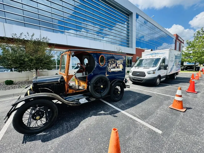 The Shine Brite Model T and Transit truck on a commercial job site