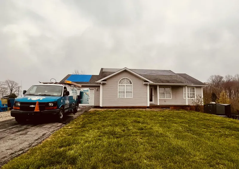 Single-story home and the Shine Brite truck during a roof cleaning job