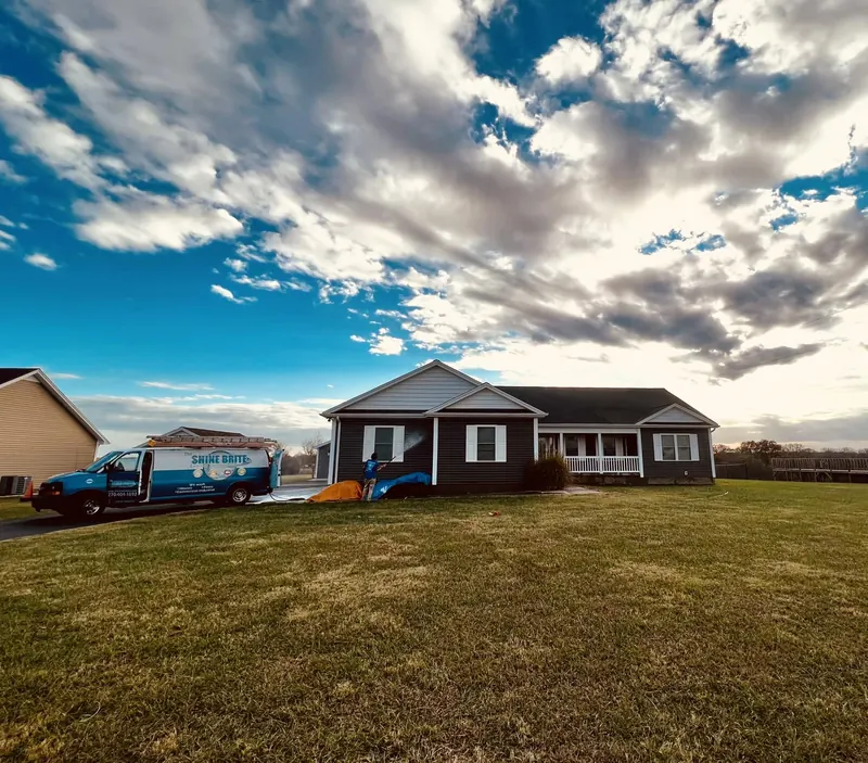 Brick ranch under dramatic clouds