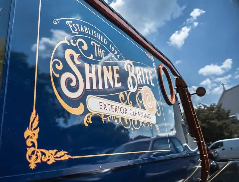 Close-up of the hand-lettered Shine Brite logo on the Model T