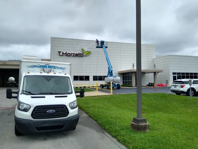 Shine Brite box truck and boom lift at a food manufacturing plant
